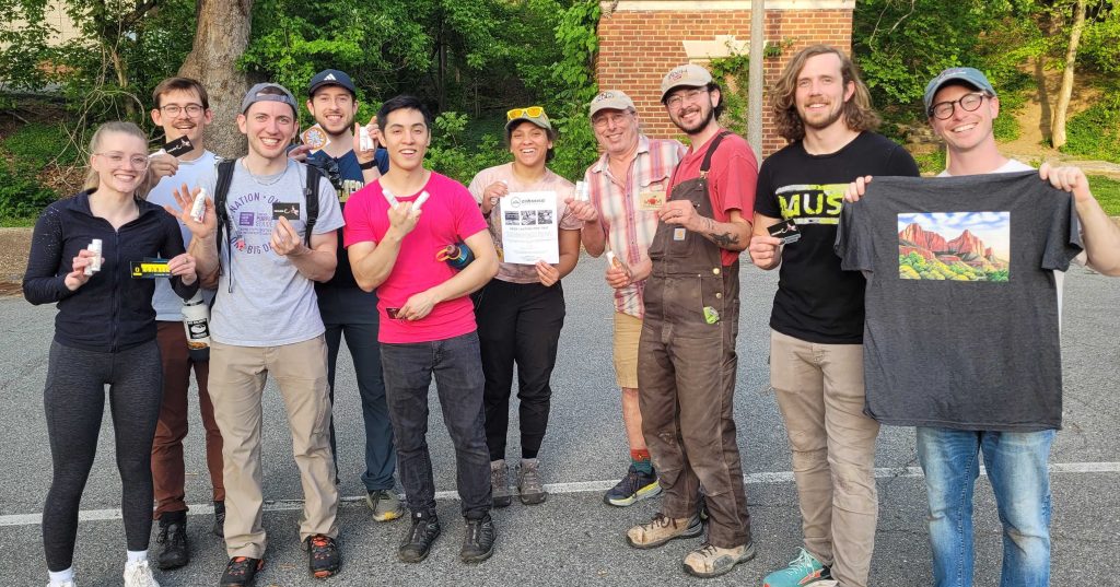 Group of volunteers holding raffle prizes after the Northwest Branch Adopt a Crag
